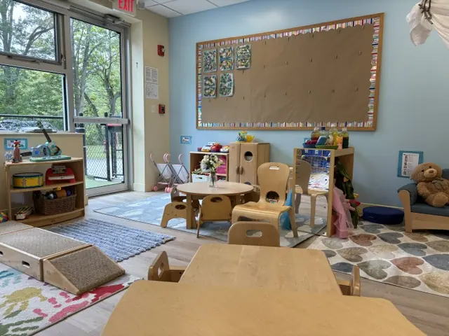 A bright, thoughtfully arranged classroom with natural light and discovery areas at Blossom Station